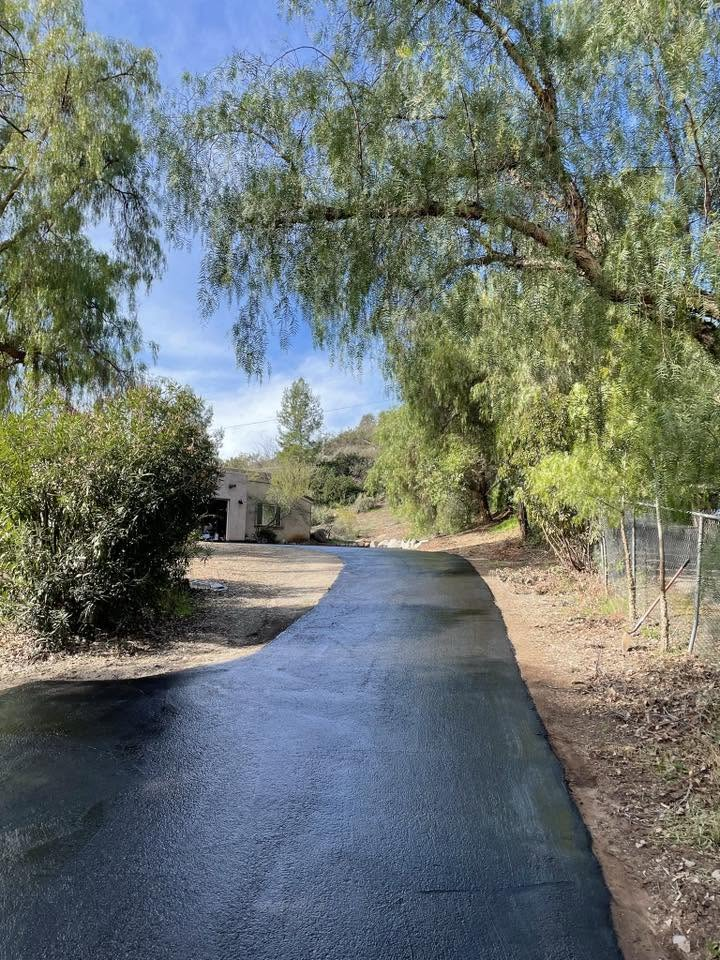 Residential asphalt driveway freshly paved and finished